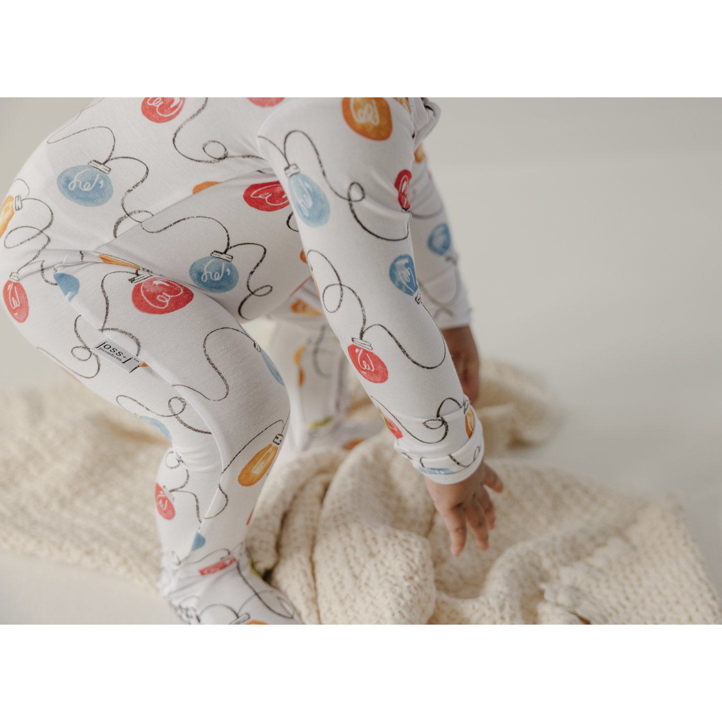 Joss + J ivory holiday lights ruffle sleeper